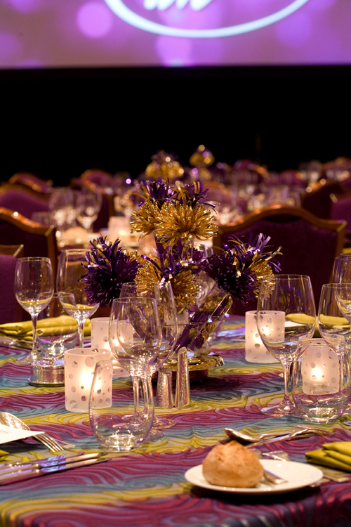 President’s Circle Annual Party With Wanderfuls Centerpieces In Gold And Purple.